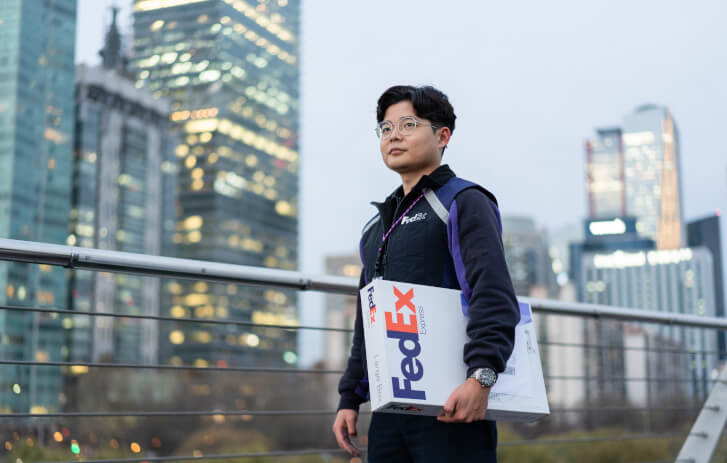 FedEx worker holding a package