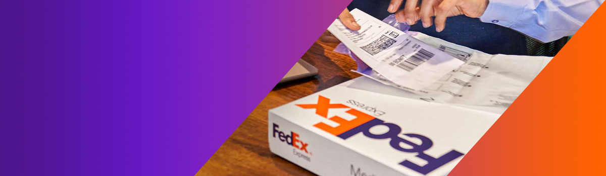 A person placing a FedEx label on a box